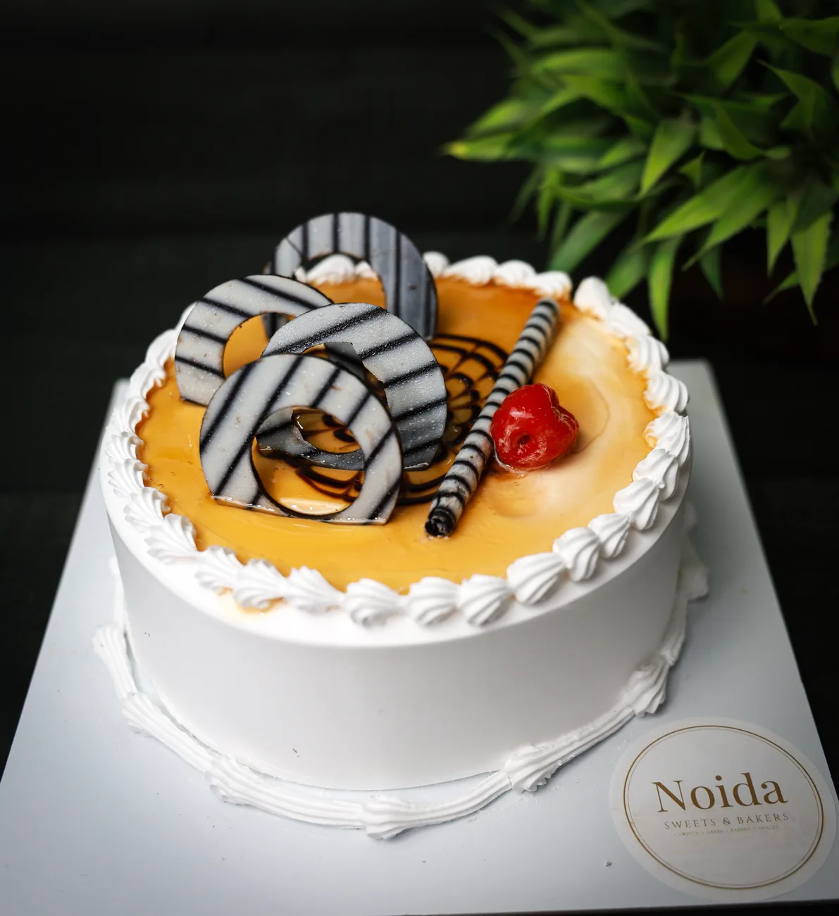 Butterscotch cake — our photo Butterscotch cake with caramel drip — made at Noida Sweets and Bakers