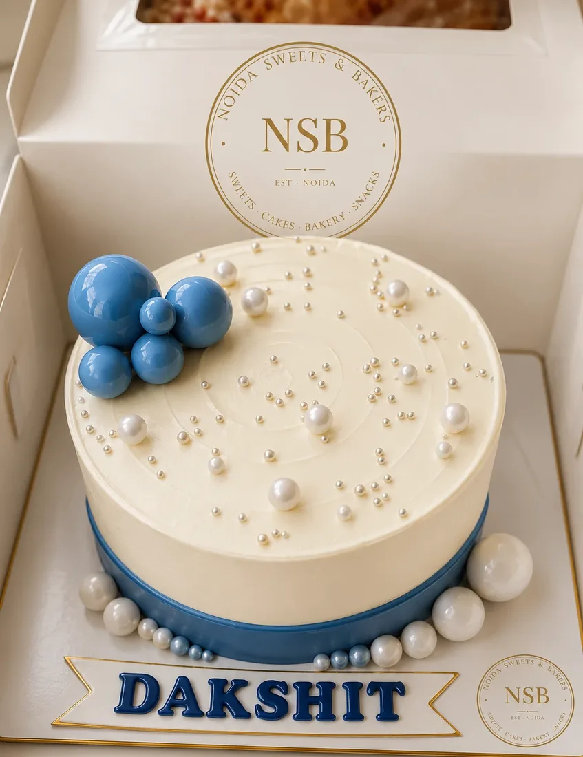 Custom name cake — our photo Customised pearl name cake in our gift box — made at Noida Sweets and Bakers